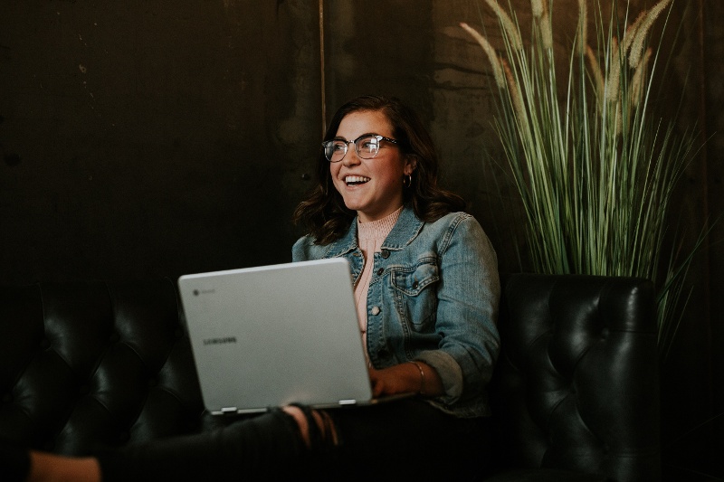 Happy woman on her laptop